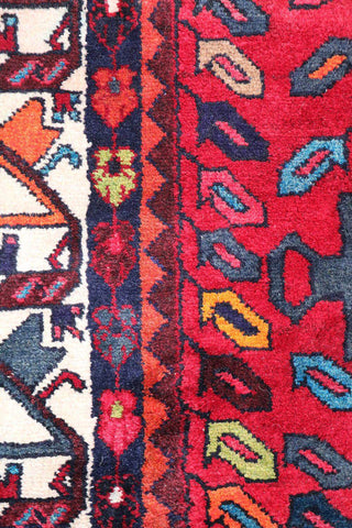 A bold red Hamedan tribal rug