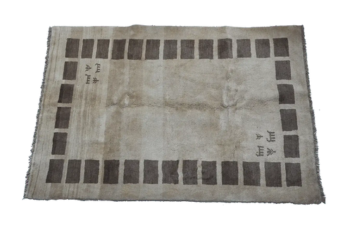 A rectangular Persian Gabbeh Tribal wool rug