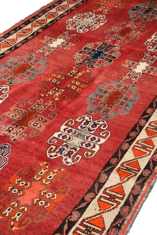 A vertical image of a Persian Qashqai Tribal Rug 