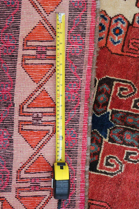 A vertical image of a Persian Qashqai Tribal Rug 