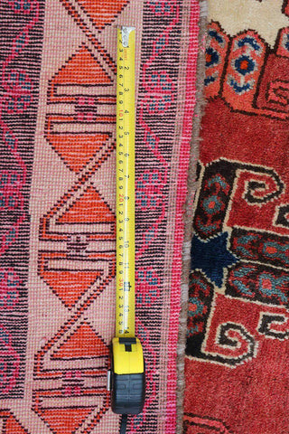 A vertical image of a Persian Qashqai Tribal Rug 