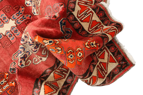 A vertical image of a Persian Qashqai Tribal Rug 