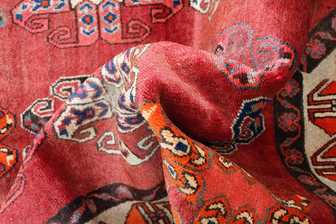 A vertical image of a Persian Qashqai Tribal Rug 