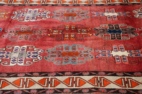 A vertical image of a Persian Qashqai Tribal Rug 