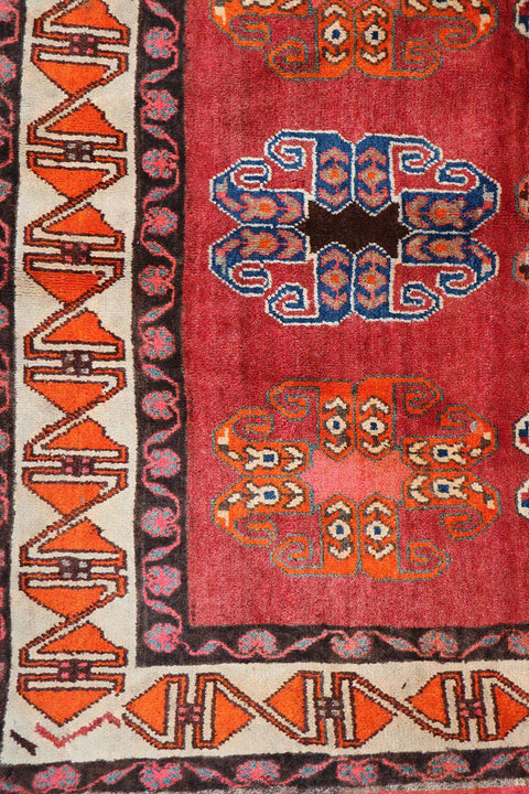 A vertical image of a Persian Qashqai Tribal Rug 