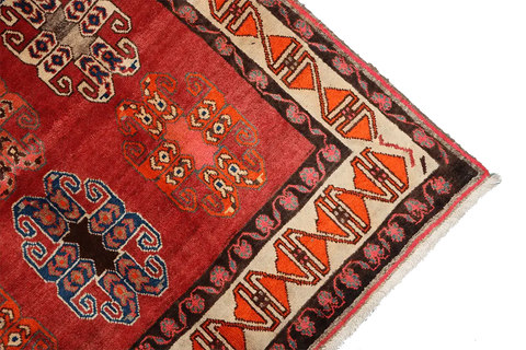 A vertical image of a Persian Qashqai Tribal Rug 