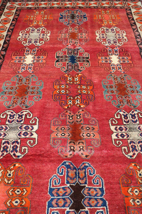 A vertical image of a Persian Qashqai Tribal Rug 