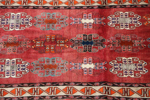 A vertical image of a Persian Qashqai Tribal Rug 