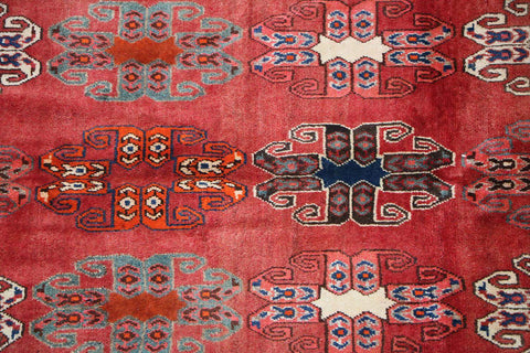 A vertical image of a Persian Qashqai Tribal Rug 