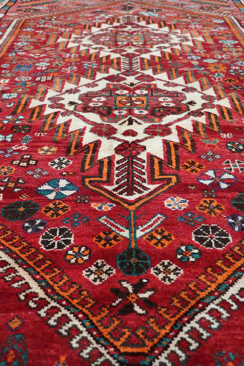 A hand-knotted Persian Qushqai Tribal Rug
