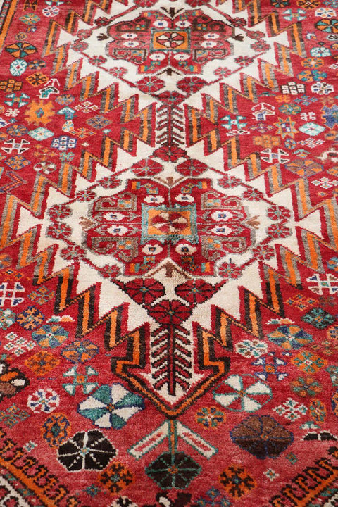 A hand-knotted Persian Qushqai Tribal Rug