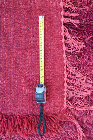 A rectangular, flatweave rug