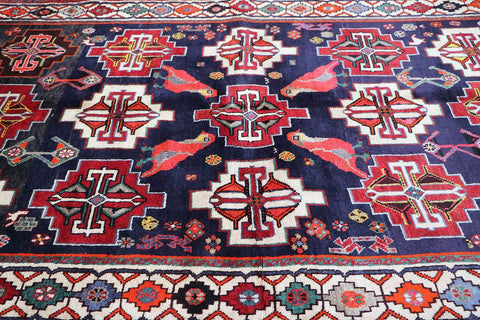 A hand-knotted Tribal Qashqai Wool Rug