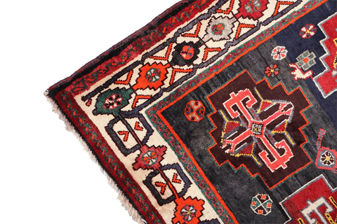 A hand-knotted Tribal Qashqai Wool Rug