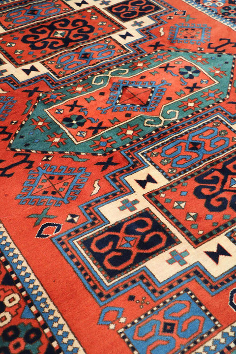 A hand-knotted Afghan tribal wool rug