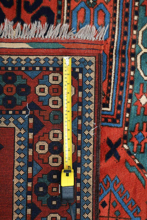 A hand-knotted Afghan tribal wool rug