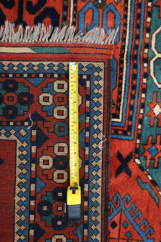 A hand-knotted Afghan tribal wool rug
