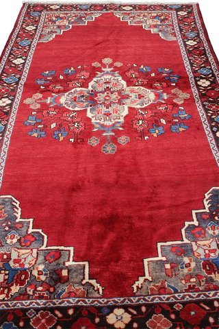 A vibrant red wool rug