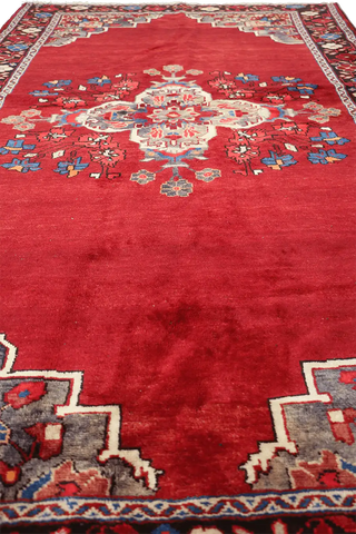 A vibrant red wool rug