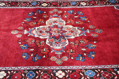 A vibrant red wool rug