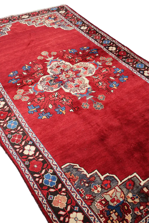 A vibrant red wool rug