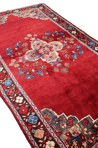 A vibrant red wool rug