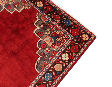 A vibrant red wool rug