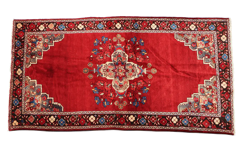 A vibrant red wool rug