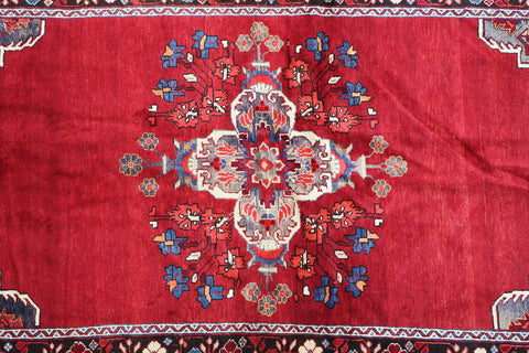 A vibrant red wool rug