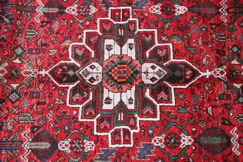 A long, rectangular, red wool rug 