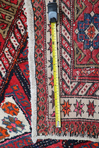 A rectangular Old Tabriz wool rug