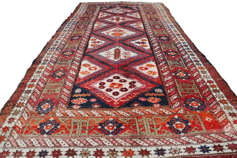 A rectangular Old Tabriz wool rug