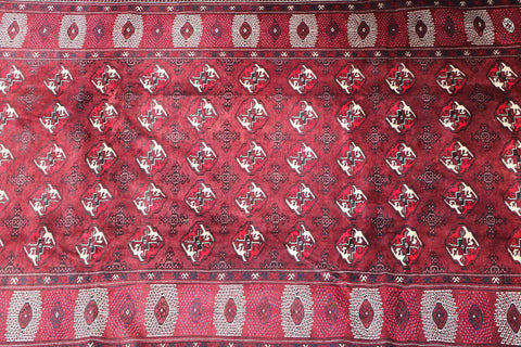 A hand-knotted Turkeman Tribal Wool Rug