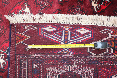 A hand-knotted Turkeman Tribal Wool Rug