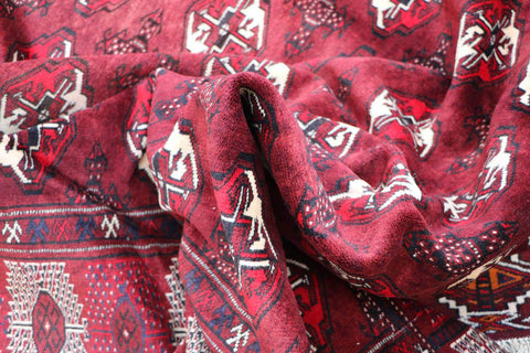 A hand-knotted Turkeman Tribal Wool Rug