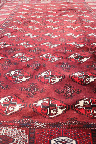 A hand-knotted Turkeman Tribal Wool Rug