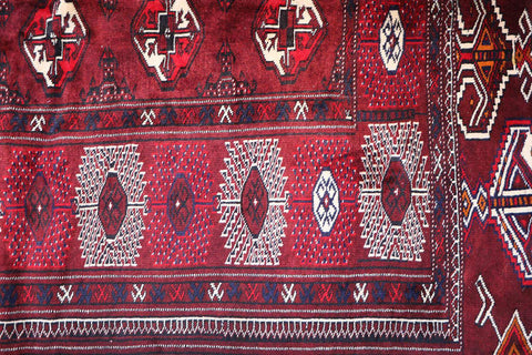 A hand-knotted Turkeman Tribal Wool Rug