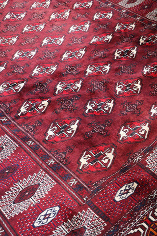 A hand-knotted Turkeman Tribal Wool Rug