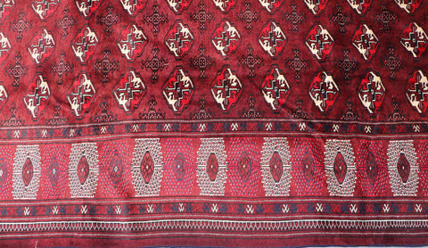 A hand-knotted Turkeman Tribal Wool Rug