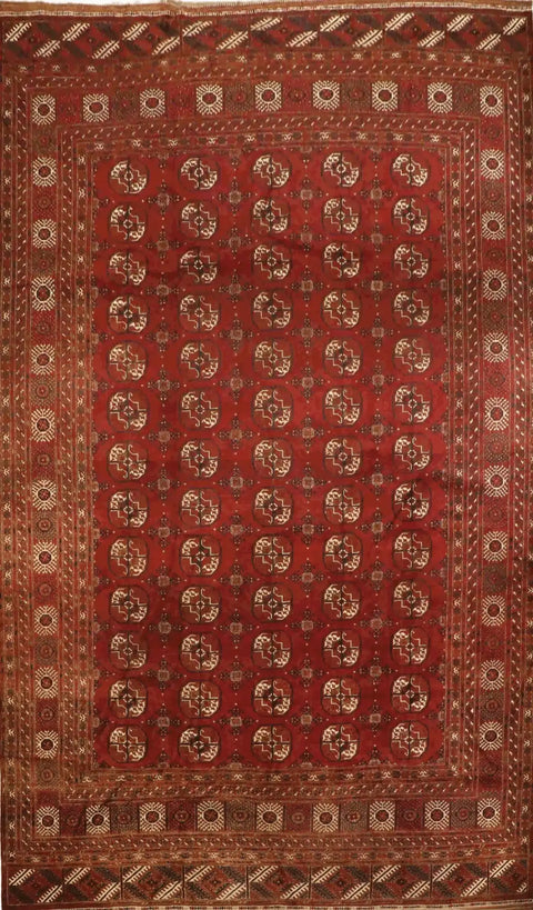A red and beige colored Afghan wool rug 