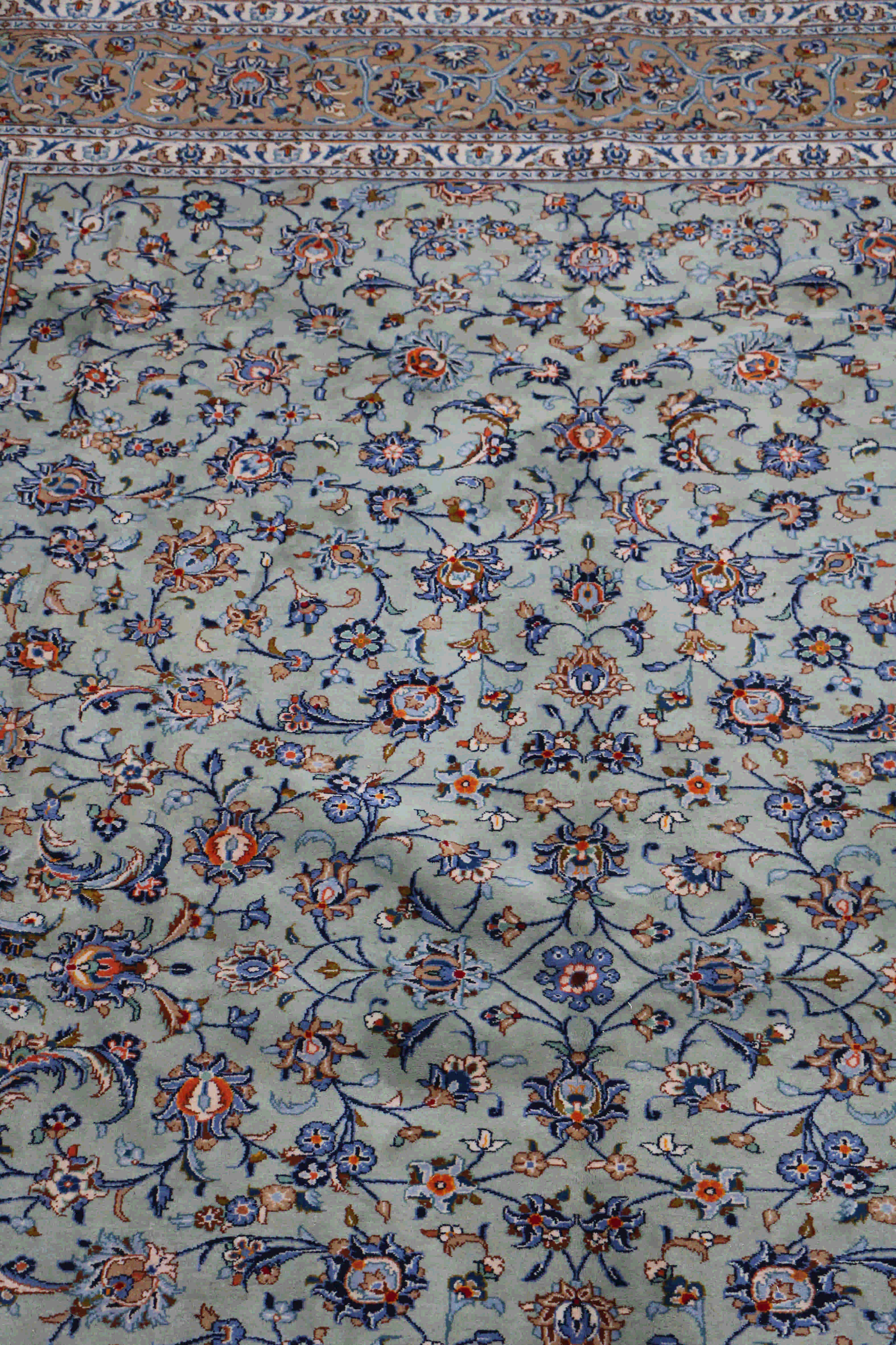 Persian Kashan rug with a turquoise field