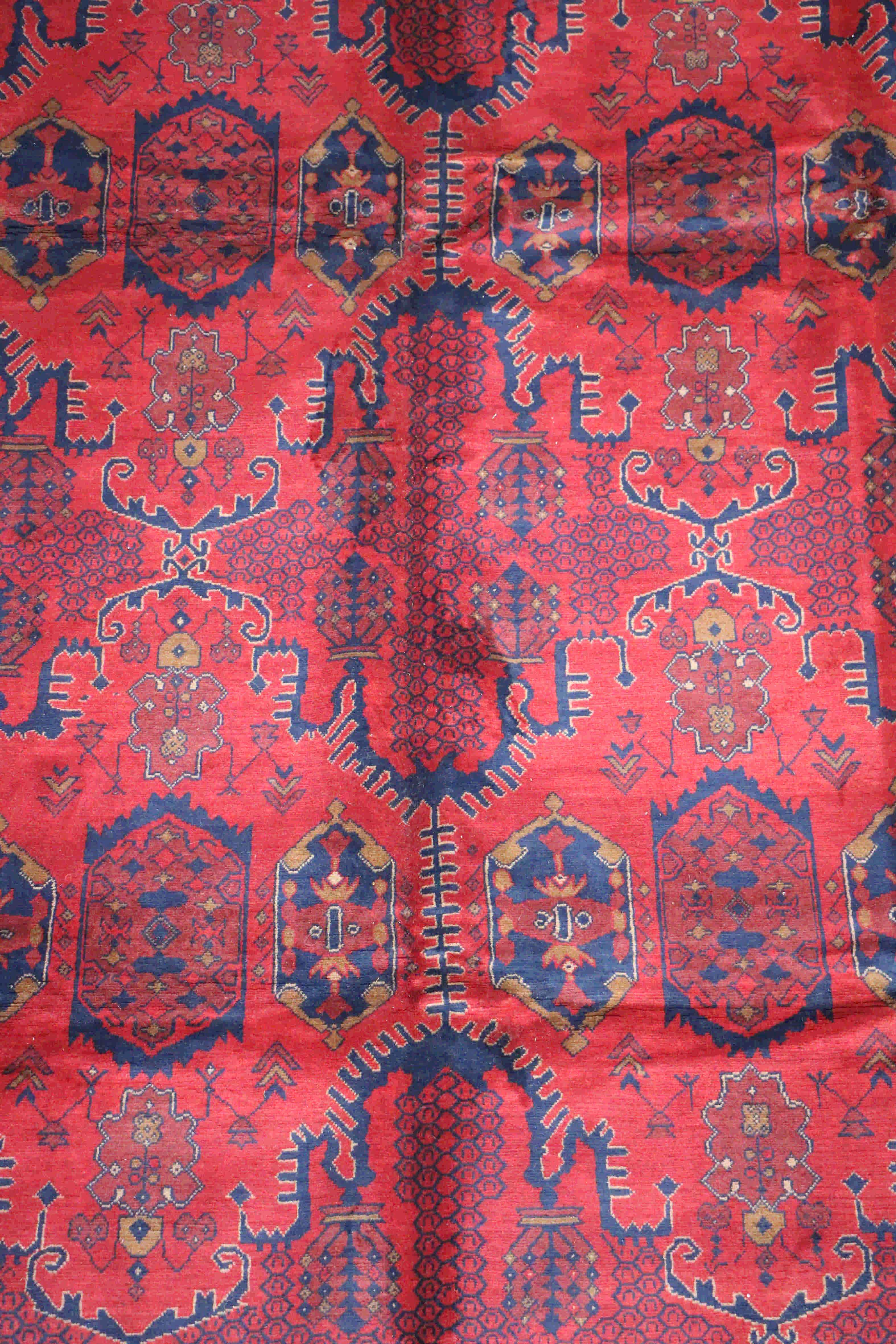Handmade geometrical tribal red rug
