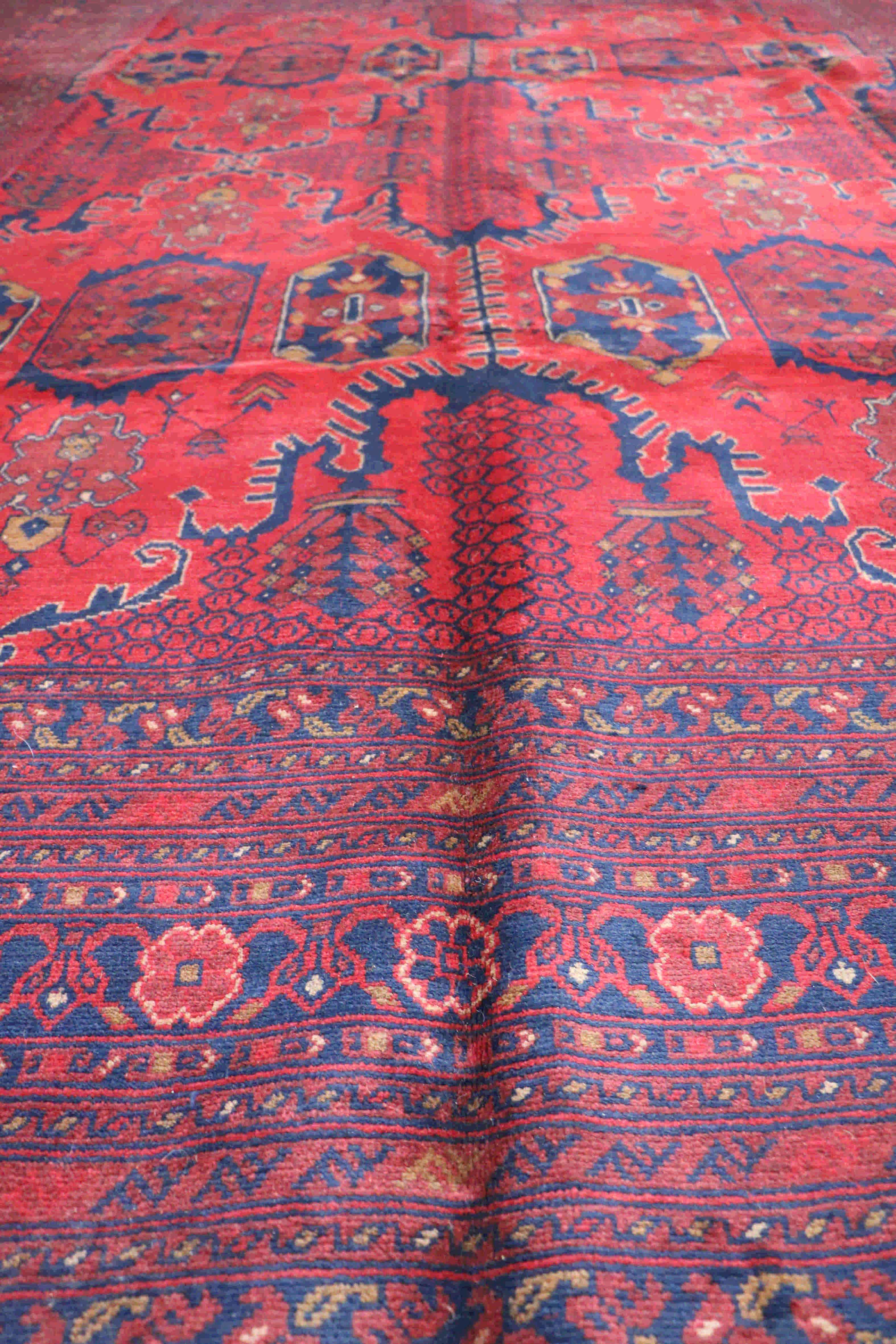 Lush and soft afghan khan rug with deep reds