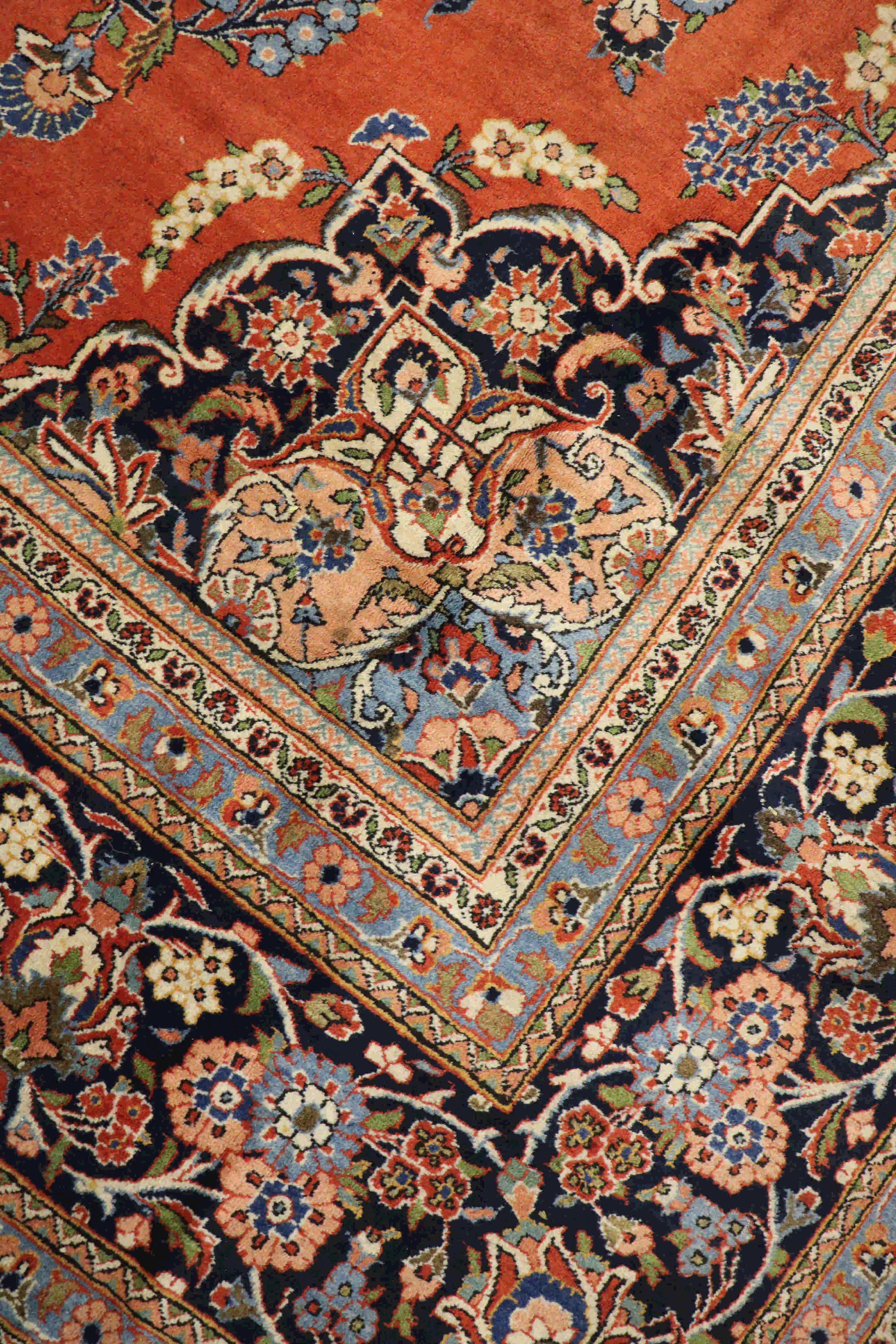 Intricate border design on a persian kashan rug