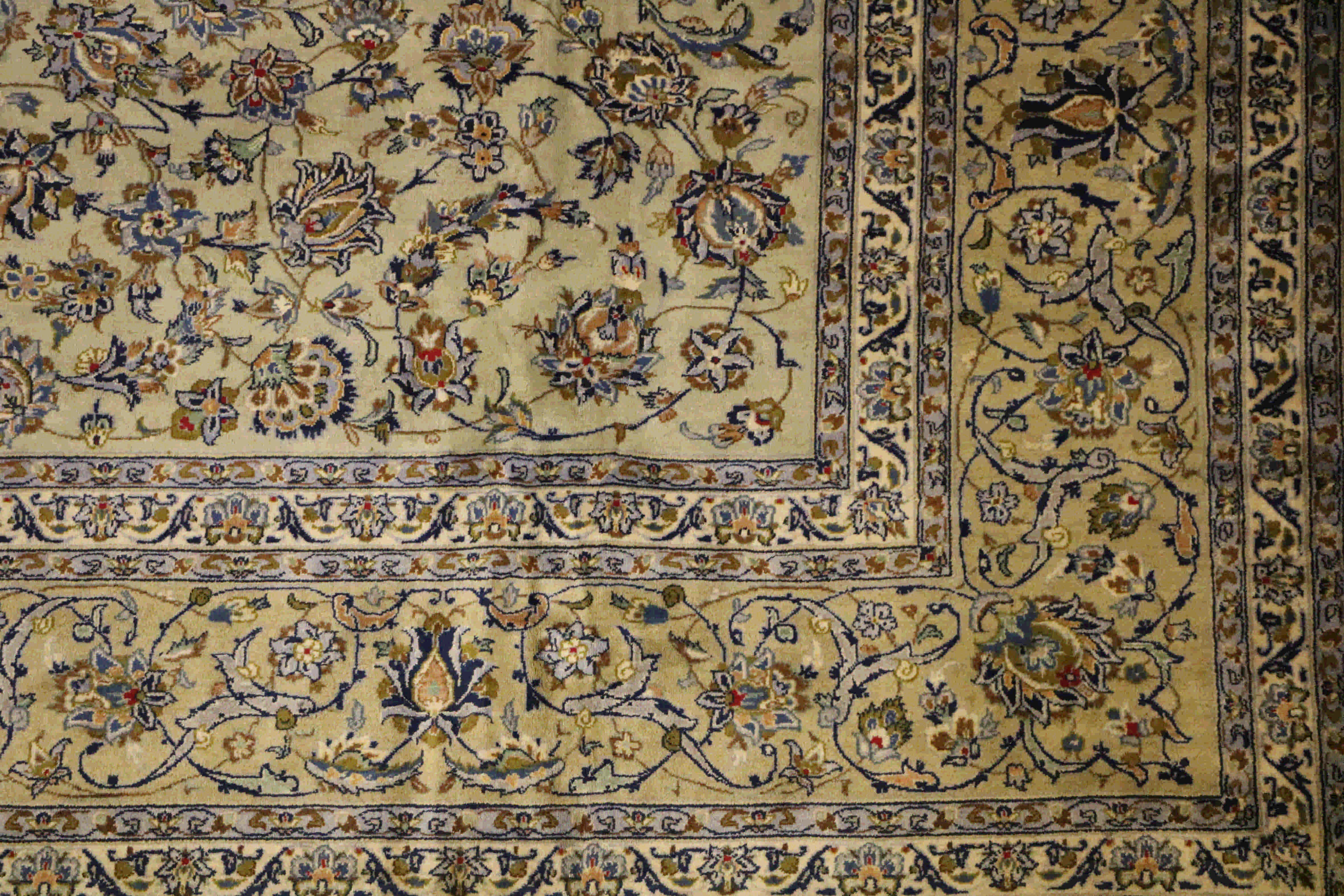 Grey, blues, and cream persian Kashan rug border